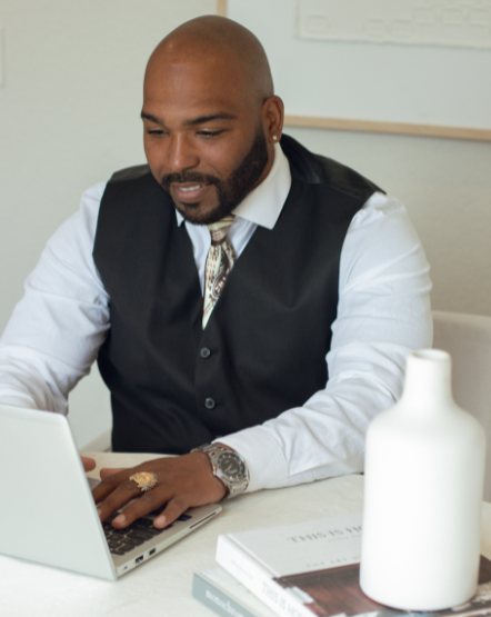 founder working at his laptop during a branding shoot